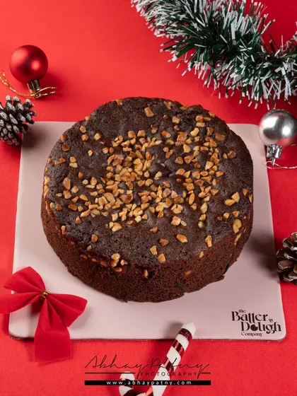 A classic Christmas fruit cake. I used festive props like pine cones, ornaments, and a candy cane to create a warm, holiday atmosphere that instantly says "Christmas."