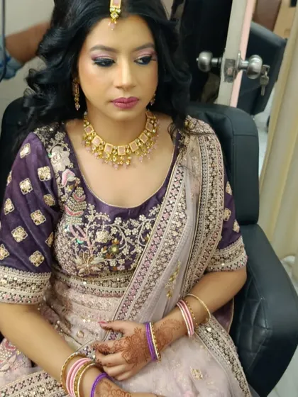 Our makeup is designed to enhance your features beautifully. Here you can see the balanced look, with attention to both the eyes and a soft lip color, creating a harmonious and elegant appearance for any wedding function.