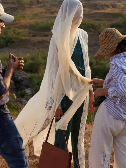 The stylist and I collaborating on set to get the perfect flow and drape of the fabric. These small, thoughtful adjustments are crucial for creating a beautiful final image.