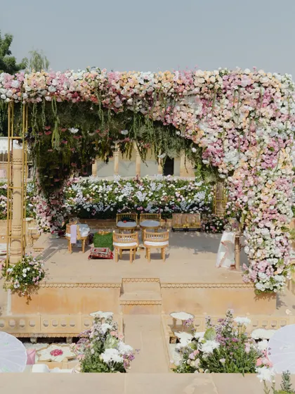 A mandap should feel like a sanctuary. For this pastel-themed ceremony at Suryagarh, we created a breathtaking floral arch that felt both grand and intimate. Using layers of soft pinks, gentle pastels, and lush greens, we designed a space that was a breath of calm, allowing the couple's vows to be the true centerpiece.