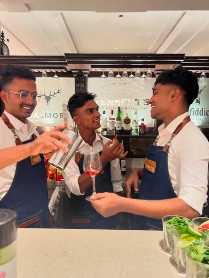 The "Trinity" team sharing a laugh, showcasing the fun and positive environment we foster within our team and at our events.