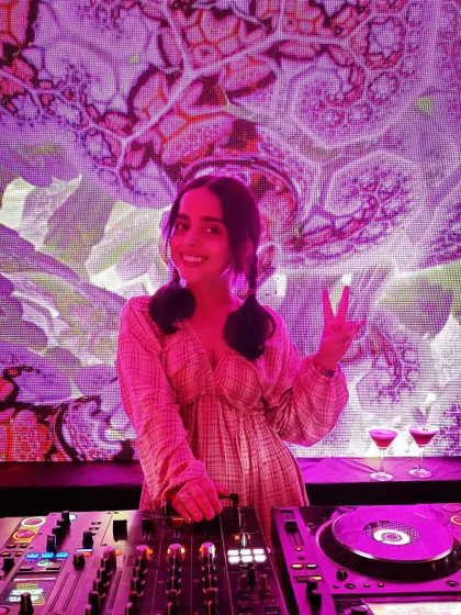 A happy moment behind the decks with a psychedelic visual backdrop. This captures the joy and fun of DJing, especially when the production is as creative as the music.