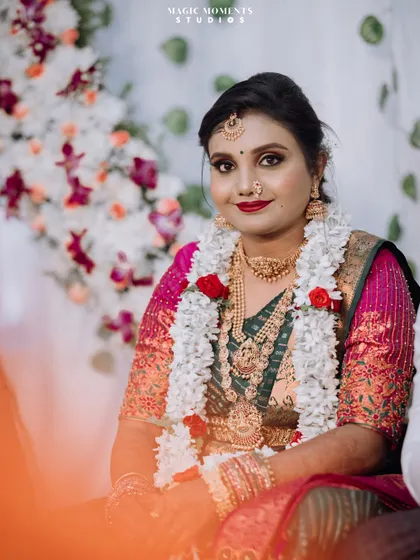 A beautiful portrait of the bride during her engagement ceremony, looking elegant in her traditional attire and jewelry.