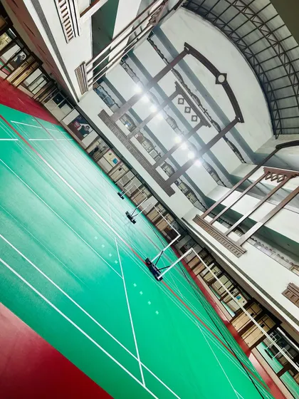 This angled shot showcases the scale of our facility. The excellent overhead lighting ensures optimal visibility during fast-paced evening sessions.