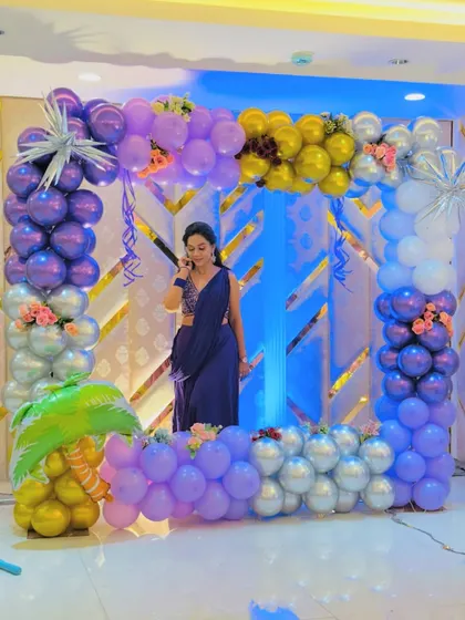 A square-shaped balloon frame in purple, silver, and gold, creating a perfect selfie point for a party.