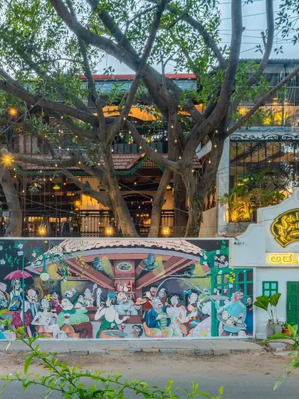 We were honored to recreate a famous illustration of old Bangalore for Adda 1522. This exterior mural not only beautifies the entrance but also connects the establishment to the city's rich history, creating a powerful sense of place.