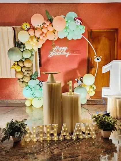 A complete and well-lit photo of the pastel jungle animal birthday setup.