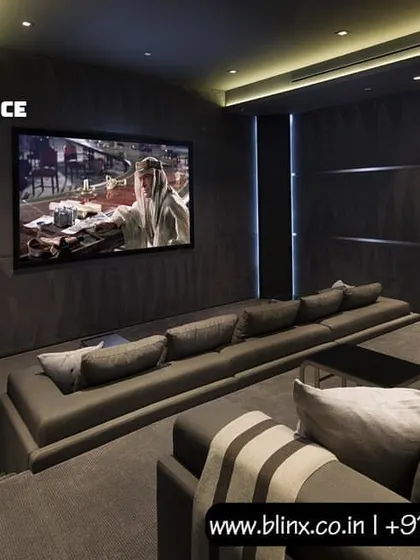 In this design, we used dark, textured wall panels and a long, comfortable sofa to create an intimate yet powerful home cinema. The large screen is the centerpiece, delivering a high-impact visual experience for movies, sports, and gaming.