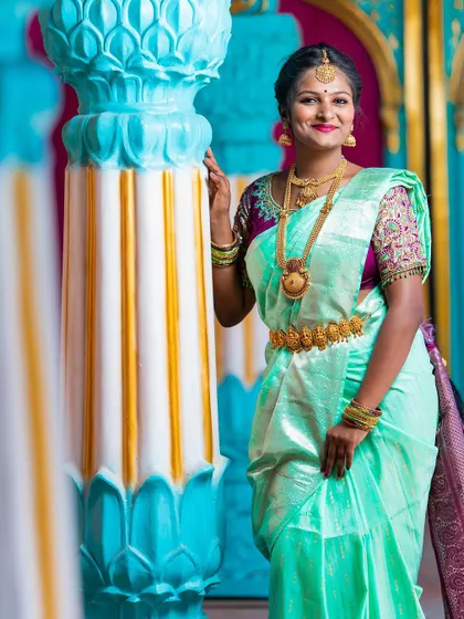 Another lovely portrait of the bride, her smile and elegant saree making for a perfect wedding day memory.