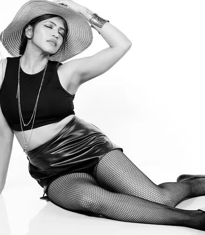 A black and white version of a reclining pose, emphasizing light and shadow.
