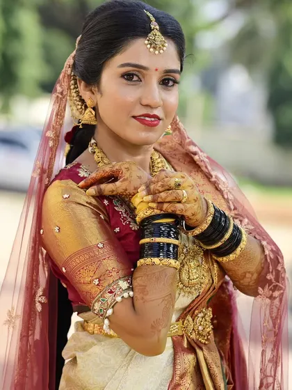 A close-up showcasing the intricate henna and how the makeup complements it. The focus is on creating a cohesive and beautiful look from head to toe.
