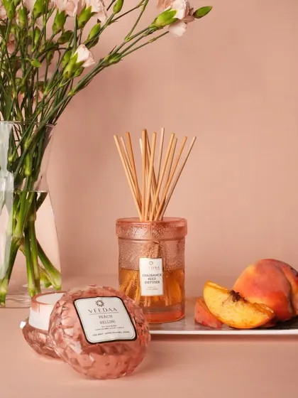 Transform your bathroom into a mini-retreat with our Peach Bellini reed diffuser and matching crystal candle. The sweet, fruity fragrance creates a spa-like atmosphere, and the beautiful jars add a touch of elegance.