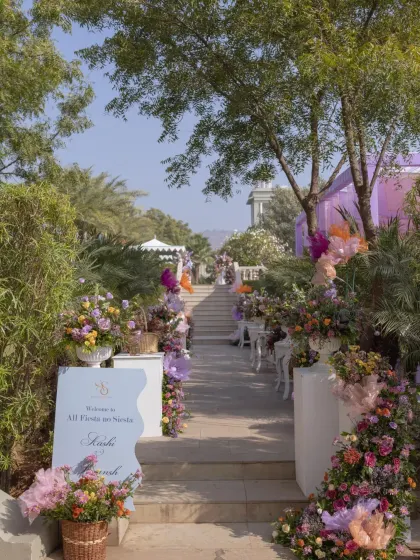 The entrance to a lavender-themed carnival, with a flower-lined staircase leading up to the event.