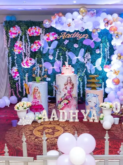 A magical Barbie and mermaid themed first birthday setup, featuring pastel balloons and enchanting decor. We ensure your vision for a themed party is beautifully documented.