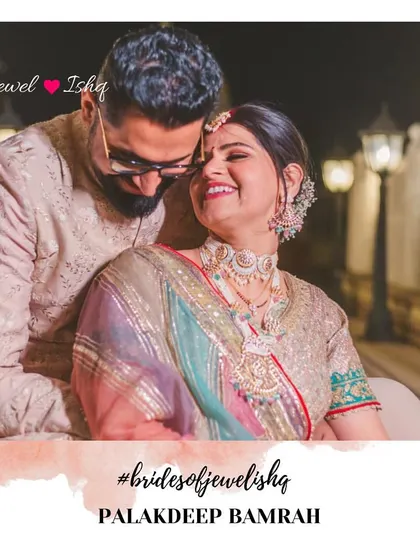 A romantic shot of the couple. The bride's custom-made pastel jewellery, including the choker, necklace, and passa, creates a unique and memorable bridal look.