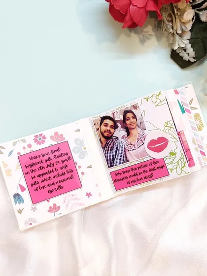 This mini scrapbook page includes a funny "boyfriend pull" note, adding a touch of humor to a romantic gift.