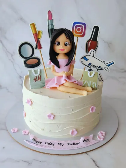 For the lady! A blueberry cake for a better half's birthday, featuring a figurine and all her favorite things: shopping, makeup, and travel.