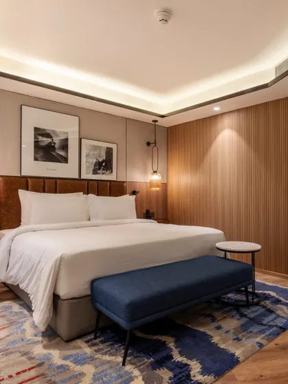 Additional views of the Radisson Resort, Khopoli, showcasing various interior and exterior details, from lobby seating areas and restaurant layouts to guest room configurations and architectural elements.