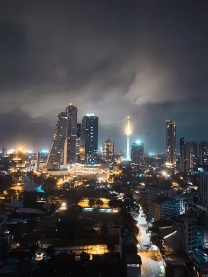 A moody, atmospheric shot of the Colombo skyline at night. Using my iPhone, I captured the city lights under a dramatic, cloudy sky, demonstrating my skills in mobile photography and low-light shooting.