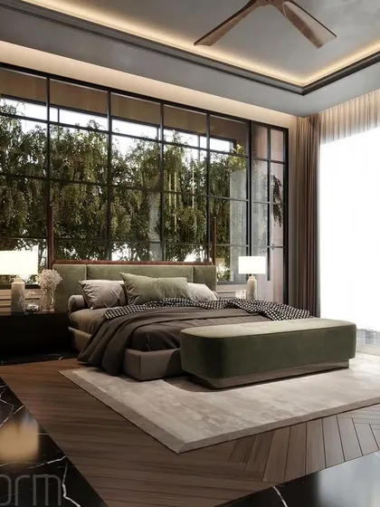 I designed this modern bedroom to be a retreat embraced by nature. The floor-to-ceiling windows blur the line between indoors and out, while the black marble floor provides a dramatic contrast to the green and earthy tones.