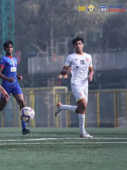 A player tracks back to defend, showcasing the work rate and discipline we expect from every member of our team.