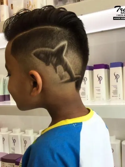 A jawsome shark design for a little ocean lover. Our stylists can create all sorts of fun and creative hair art.
