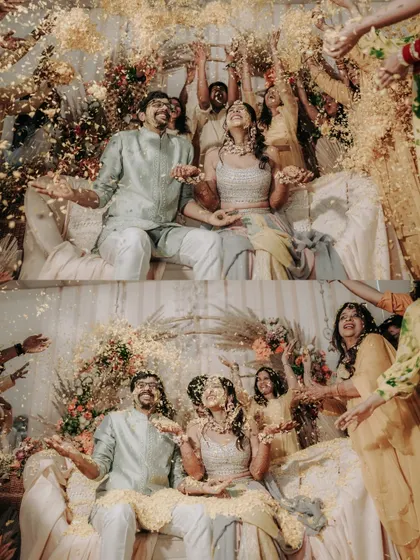 A shower of golden petals for a golden couple. This shot captures the peak of Haldi celebrations, full of laughter and blessings.