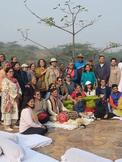 A large group of citizens gathers at Aravali Nagar Van for "Sound of Rewilding," a meditative morning concert featuring the Rudra Veena.