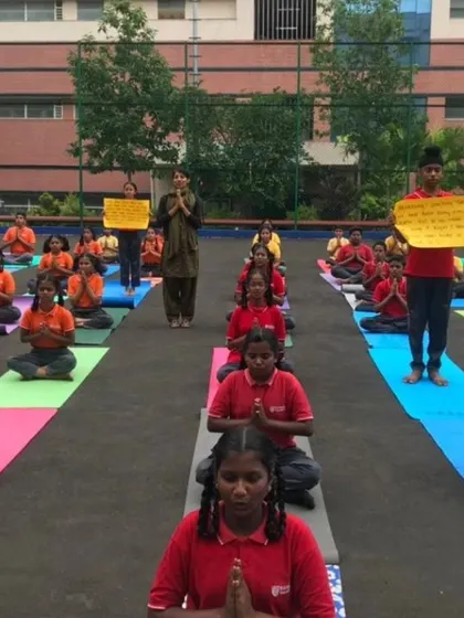 Another view of the school yoga session. The colorful mats and the students' focus create such a vibrant scene.