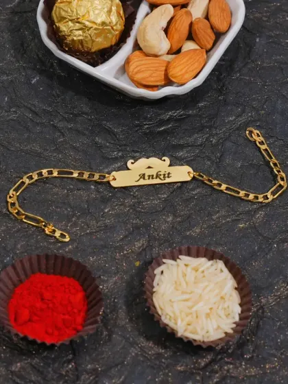 A stylish chain rakhi with a nameplate and a mustache charm, perfect for a brother with a great sense of style.