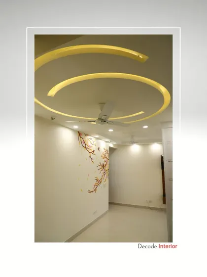 This elegant bedroom features a unique spiral-shaped POP ceiling design with cove lighting, creating a dynamic and visually interesting focal point.