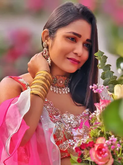 A close-up shot amidst the floral arrangements. The soft pinks and whites of the flowers perfectly complemented my outfit and the romantic vibe of the Mehndi.