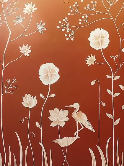 This close-up view highlights the egret and lotus flowers from a custom mural in Bangalore. The varying depths of the texture create a lifelike quality, making the artwork a central part of the room's story.