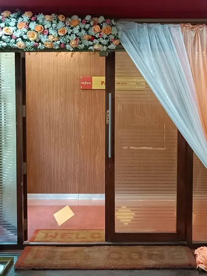 A simple and sweet entrance decor with peach-colored florals and drapes. It's a lovely way to welcome guests to an engagement party or intimate gathering.