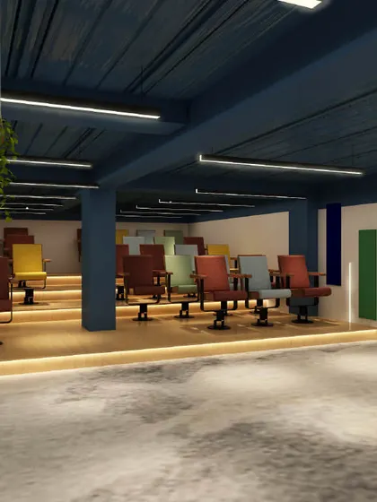 An auditorium or training room with colorful, tiered seating. The design is functional and energetic, perfect for presentations and company-wide meetings.