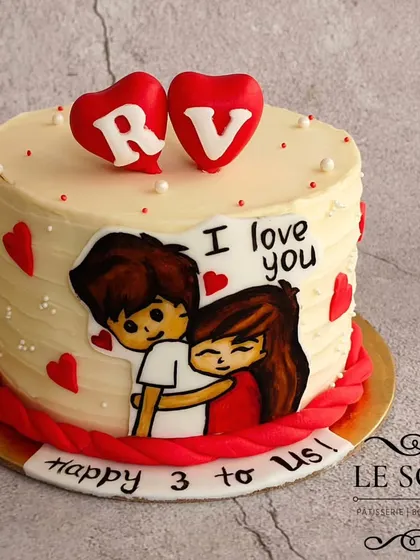 This anniversary cake features a cute hand-painted couple, a textured buttercream finish, and fondant hearts. It's a sweet way to celebrate three years together.