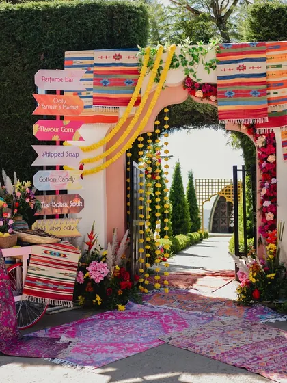 The entrance to our Souk-themed Haldi in Ooty. We used colorful rugs, dhurries, and signages to create an authentic bazaar feel right from the start.