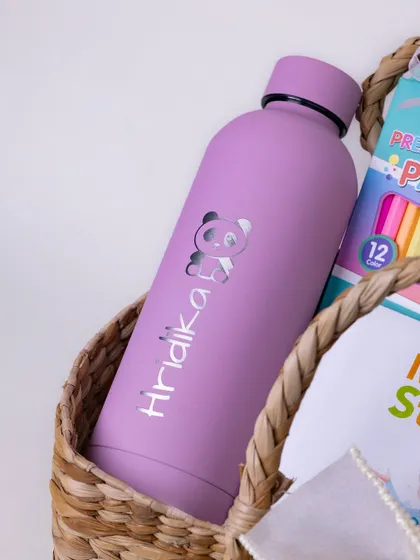 A personalized water bottle with the name 'Hridika' and a cute panda design. Custom items like this make a gift extra special for a child.