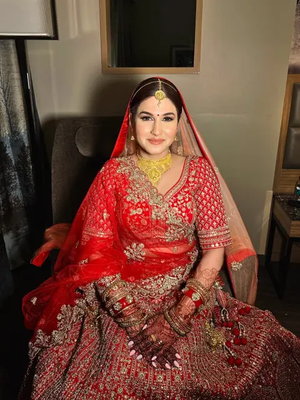 A soft smokey eye for this bride in red. This is a great option for brides who want some drama in the eyes without it being too heavy.