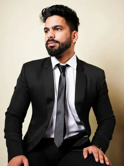 A sharp and professional corporate headshot. While styled for a business look, it still carries a touch of personality, making it suitable for an actor's portfolio for corporate roles.