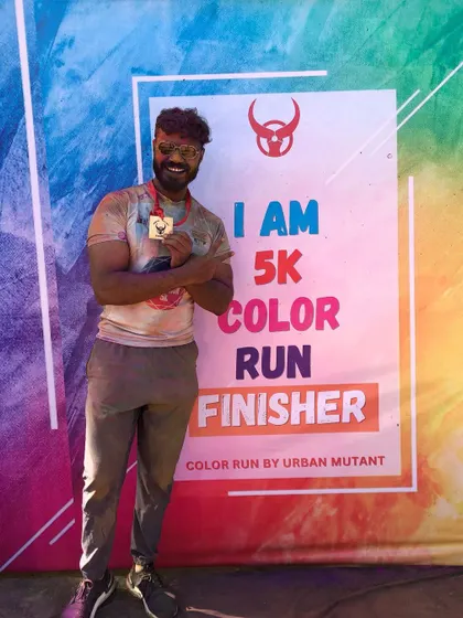 Proudly showing off my medal after the 5k color run. I encourage all my clients to set goals like this and I'll be there to help them achieve it.