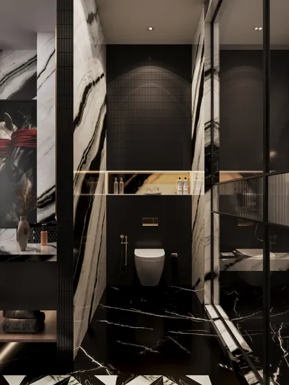 The toilet is enclosed in a space clad with the same dramatic black and white marble, creating a seamless and immersive experience. A gold-accented niche adds a touch of warmth.
