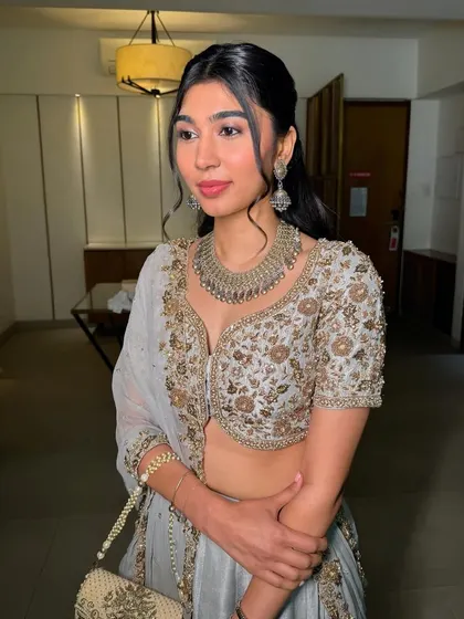 A front-facing view of this beautiful look. The makeup is polished and sophisticated, perfect for a wedding guest or bridesmaid.