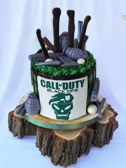 Mission accomplished with this epic Call of Duty: Black Ops cake. The design features grenades, guns, and the game's logo for a hardcore gamer's birthday.