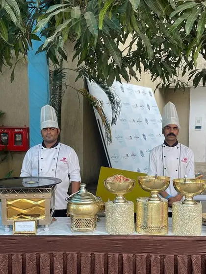 Our chefs ready to serve at a Hi-Tea event at Novotel Imagica. This setup features classic Gujarati delicacies, showcasing our ability to create themed menus for specific cultural or corporate requirements.