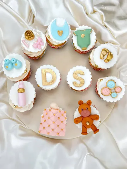 Another view of our assorted baby shower cupcakes. We love creating a mix of designs that come together to tell a sweet story.