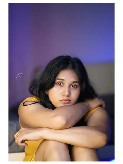 A duplicate of image 1, this close-up portrait is all about mood and expression, using minimal light to create a powerful effect.