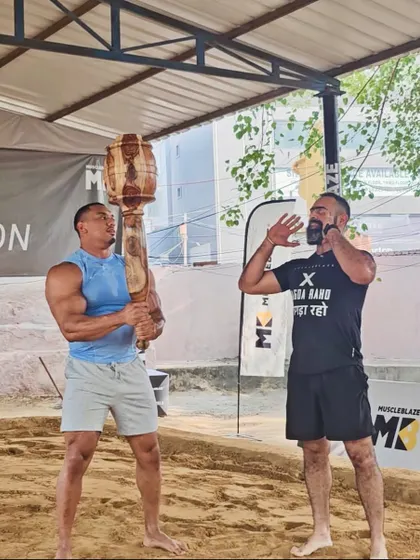 Our founder coaching an athlete in a traditional sandpit akhada. This image shows our commitment to learning from the source and sharing the authentic techniques of Indian strength training with the world.