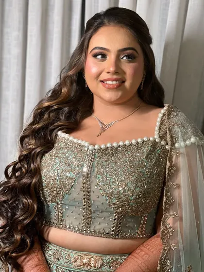 This front view shows how the waves frame the face and add a touch of softness to the overall bridal look.