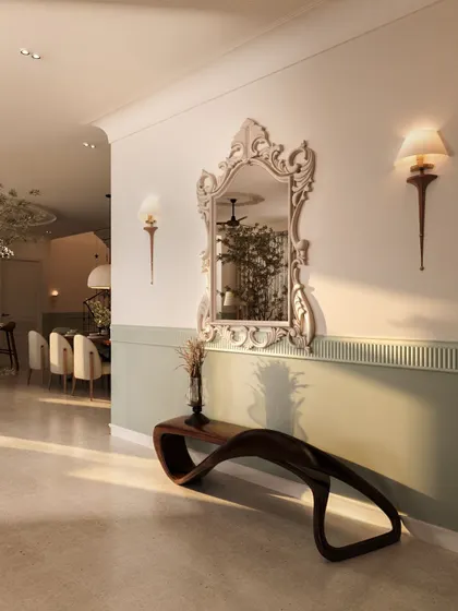 The entry foyer of this penthouse sets a dramatic tone with a two-toned green and white wall, a striking classical mirror, and a sculptural wooden bench. It's a grand welcome that hints at the home's blend of modern and classical styles.